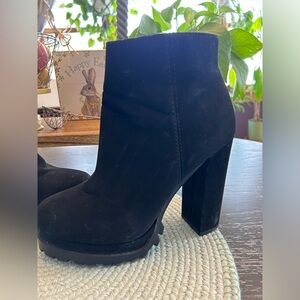 Beautiful pair of boutique boots in black.  Size 7.  4” height